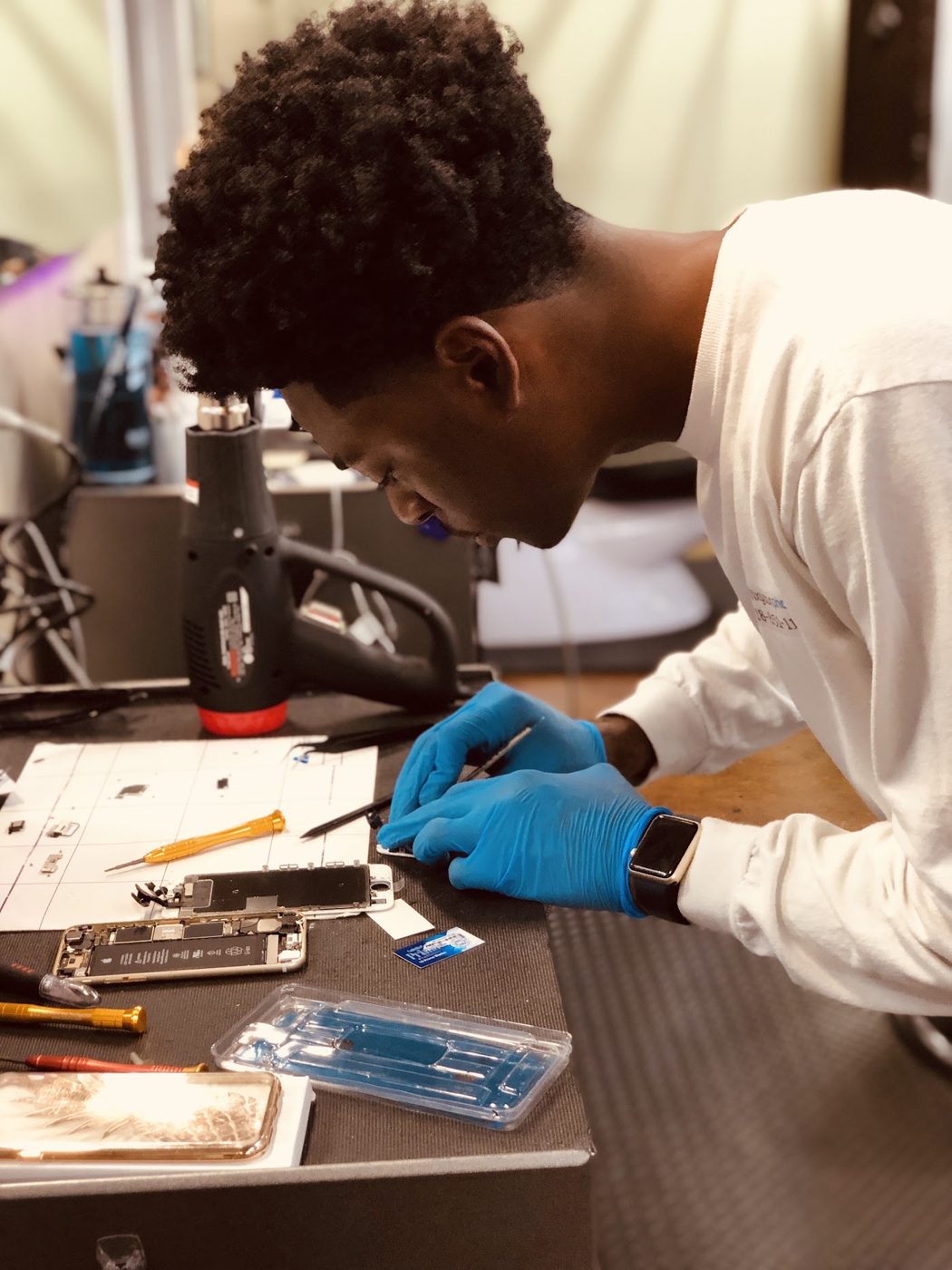 Technician repairing a phone